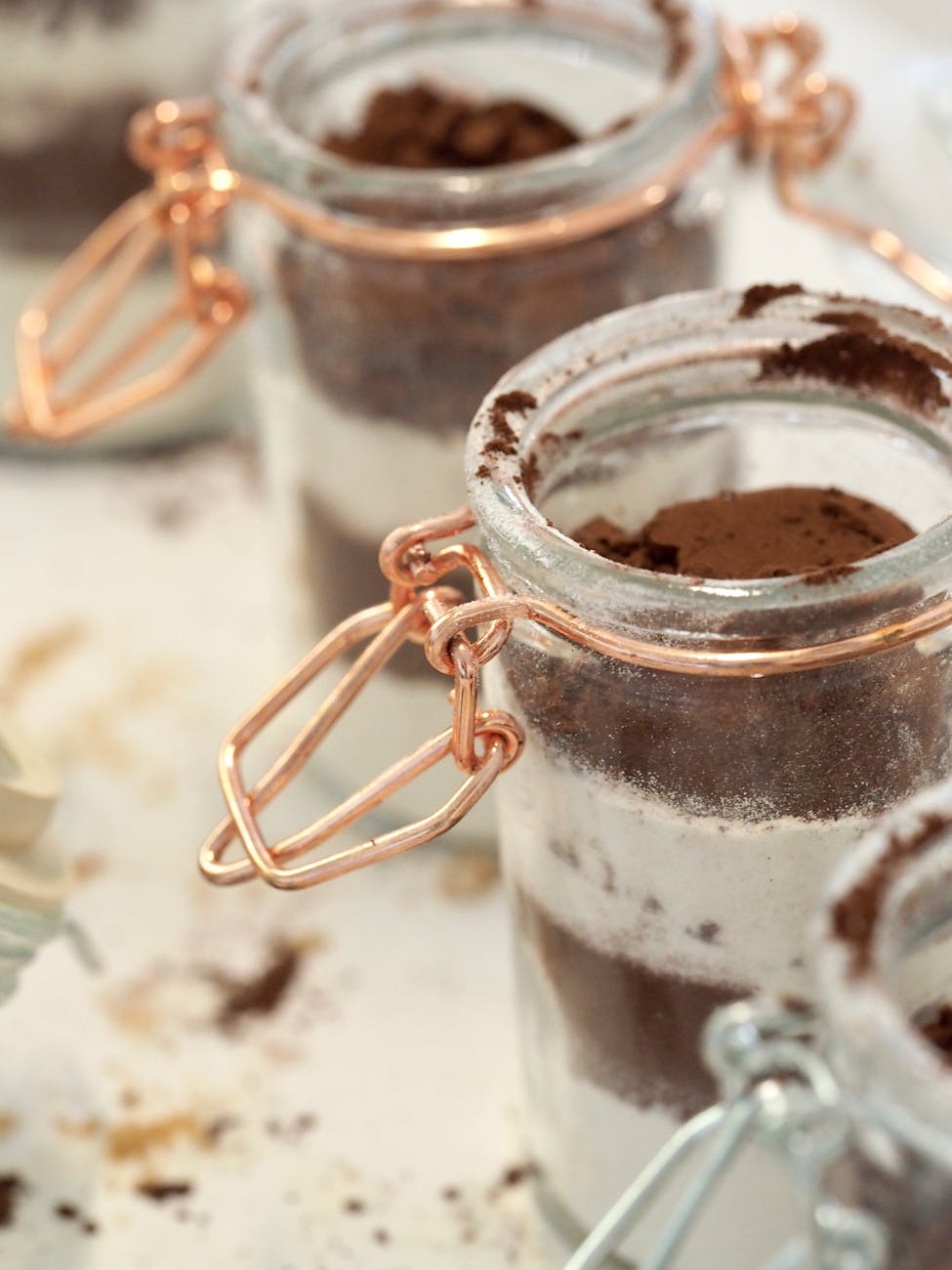 cocoa powder with powdered sugar in glass jars