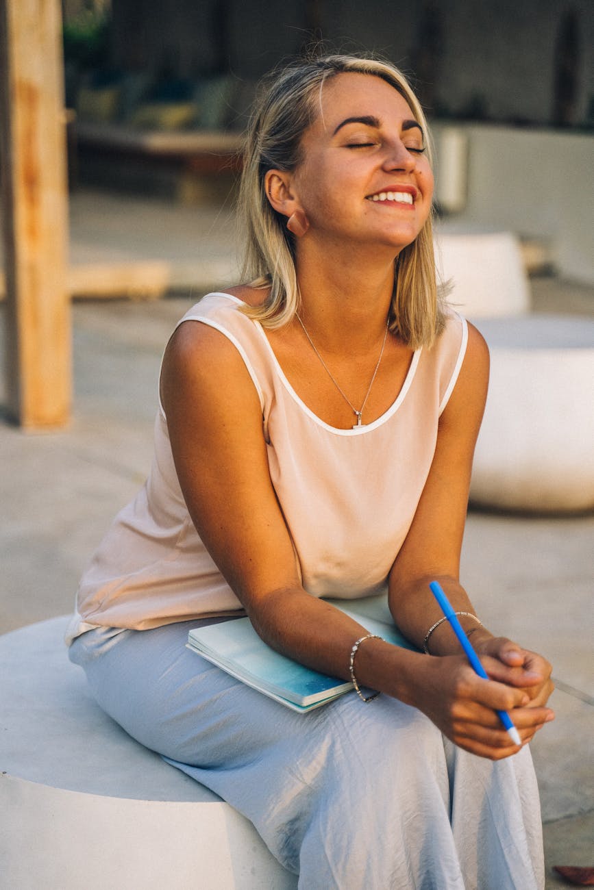 a smiling woman sitting