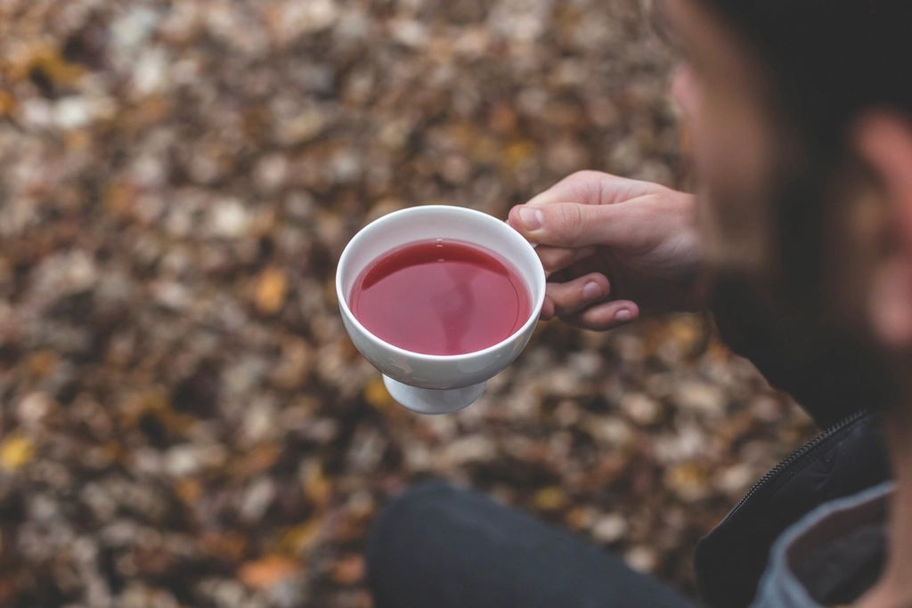 Free man holding herbal tea