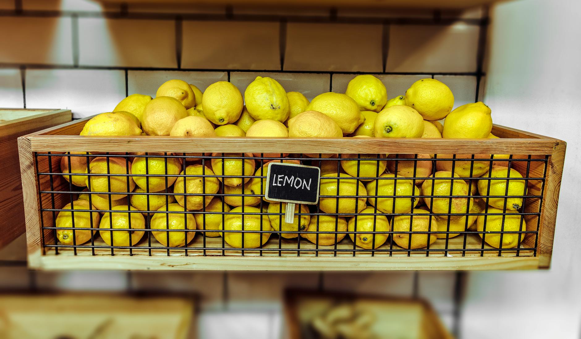 lemons inside a wooden crate